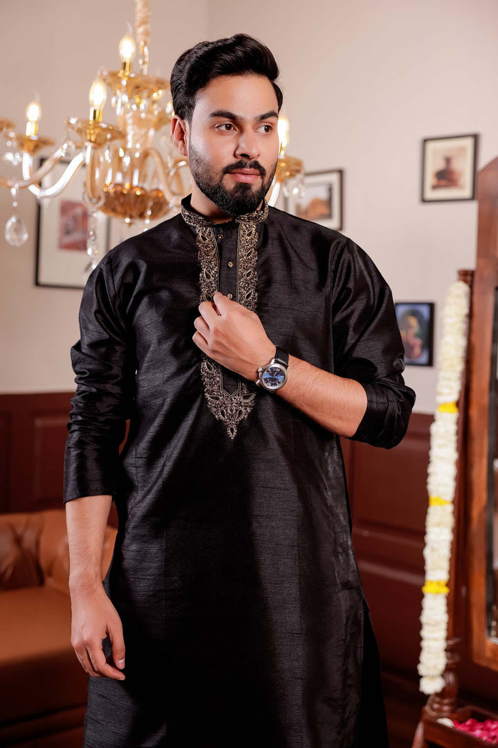 Black Raw Silk Kurta Suit with Intricate Embroidery on neckline.