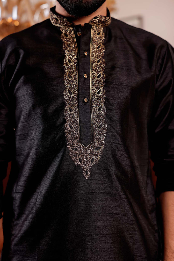 Black Raw Silk Kurta Suit with Intricate Embroidery on neckline.