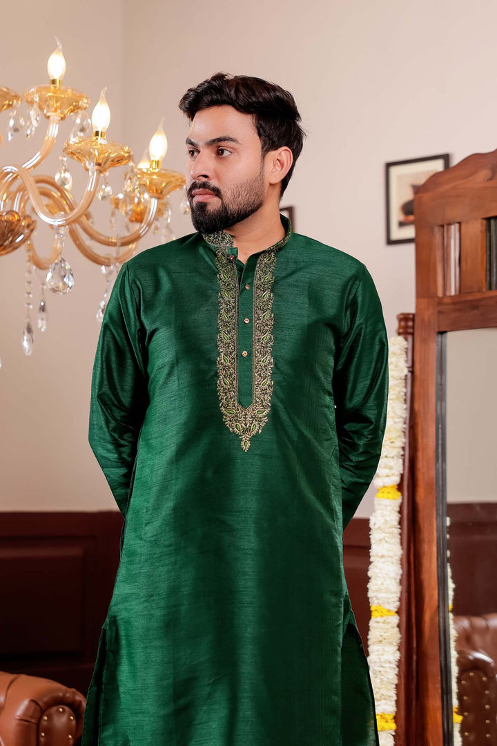 Bottle Green Raw Silk Kurta Suit with Intricate Embroidery on neckline.