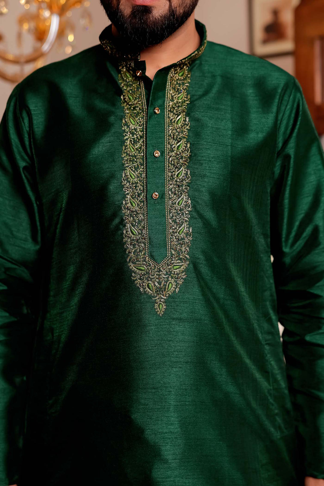 Bottle Green Raw Silk Kurta Suit with Intricate Embroidery on neckline.