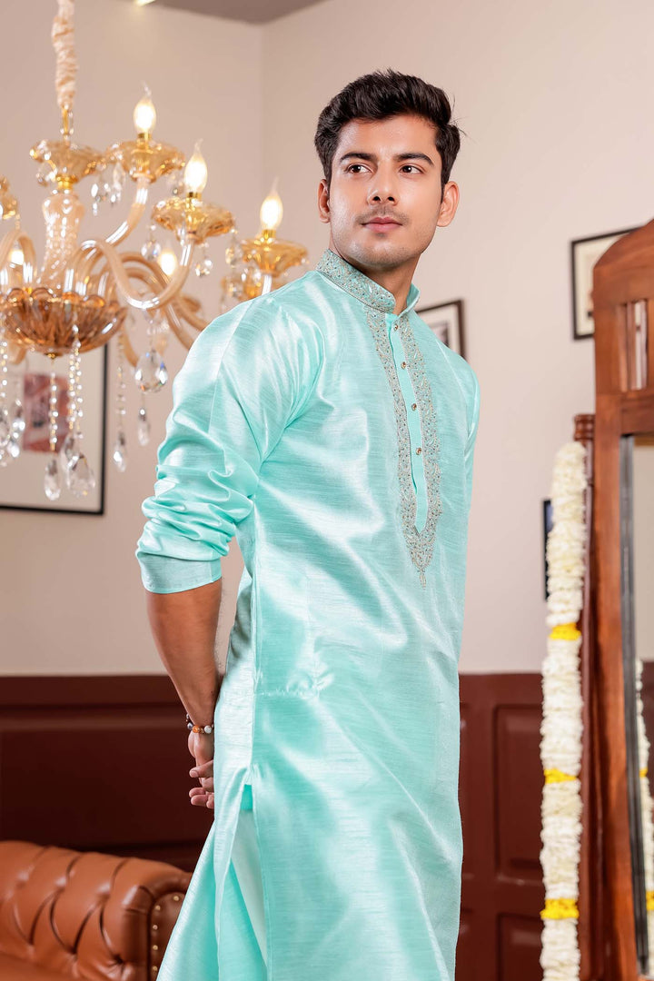 Sea Blue Raw Silk Kurta Suit with Intricate Embroidery on neckline.