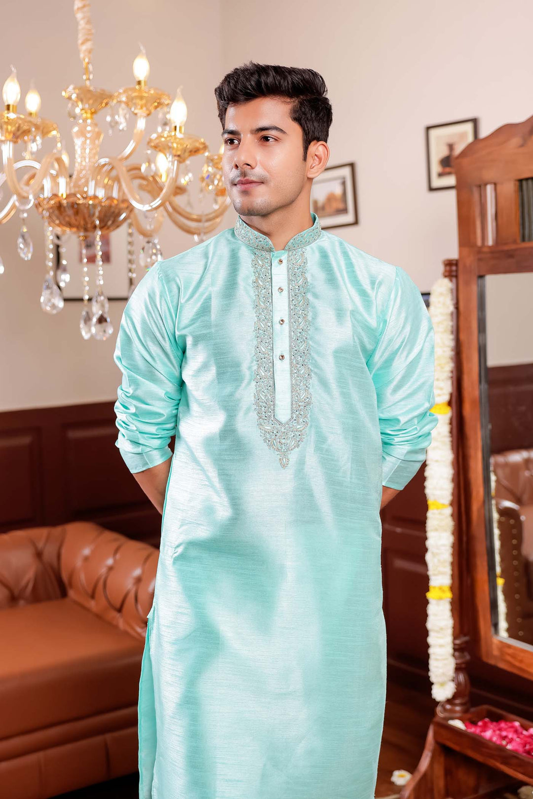 Sea Blue Raw Silk Kurta Suit with Intricate Embroidery on neckline.