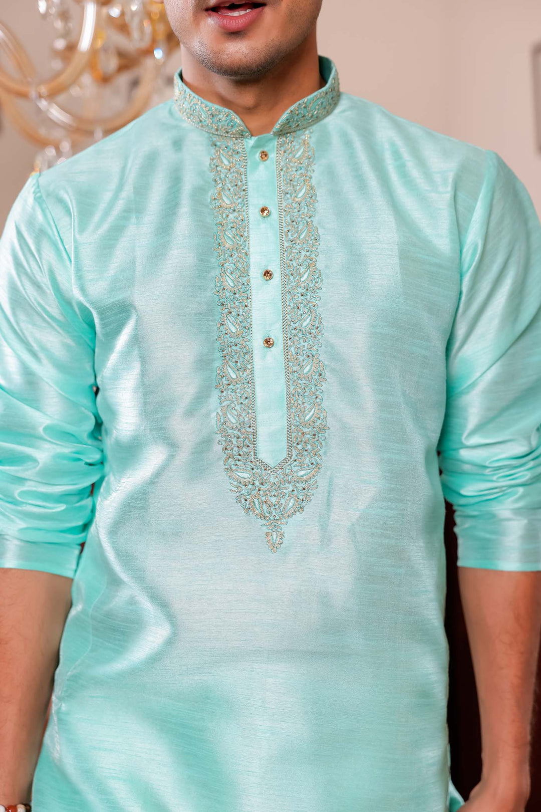 Sea Blue Raw Silk Kurta Suit with Intricate Embroidery on neckline.