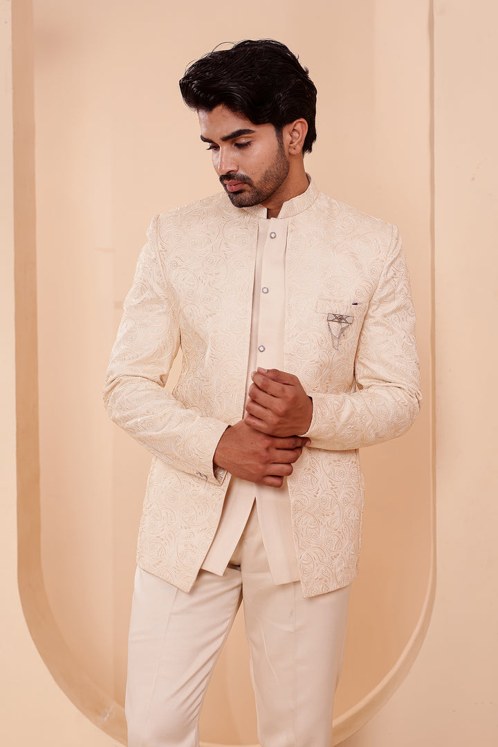 Cream Heavy Embroidered 3pcs Jacket Style Jodhpuri Suit.