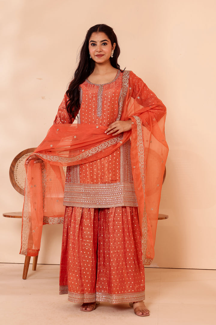 Rust Shimer Butti Sharara Suit.
