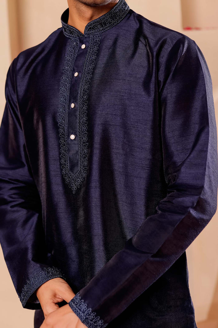 Navy Blue Raw Silk Kurta Suit with Intricate work on neckline.