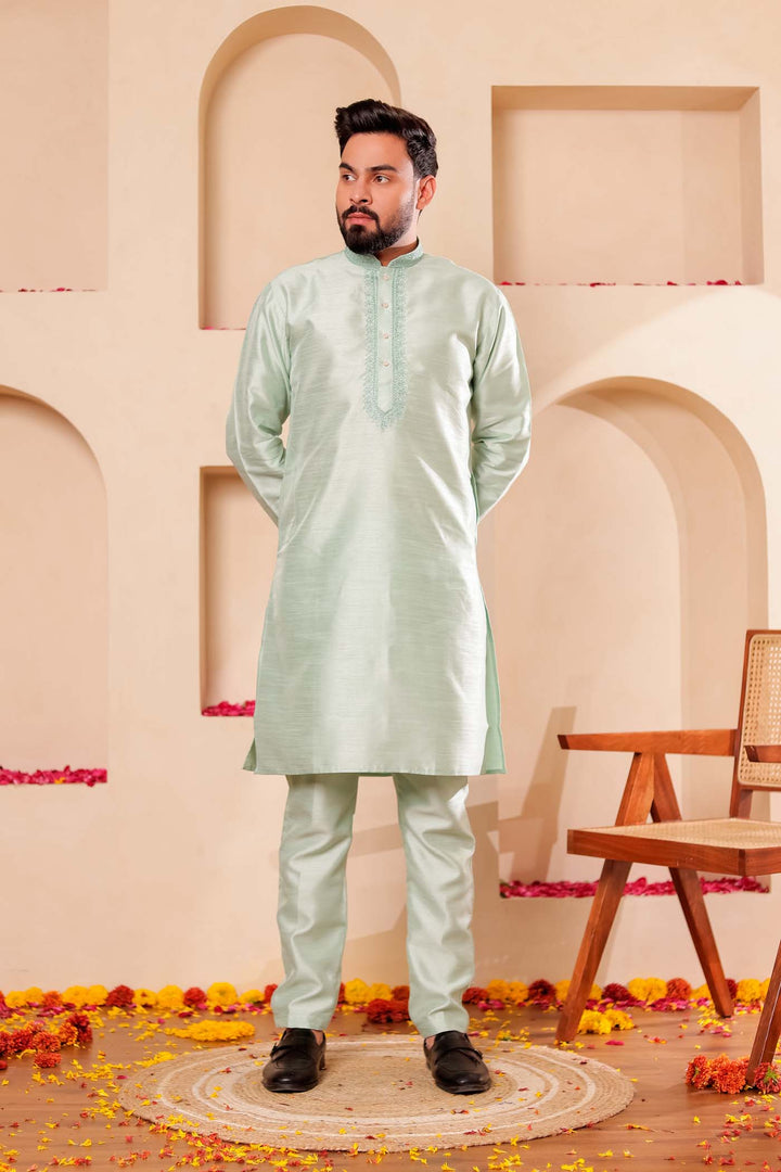 Pista green Raw Silk Kurta Suit with Intricate work on neckline.