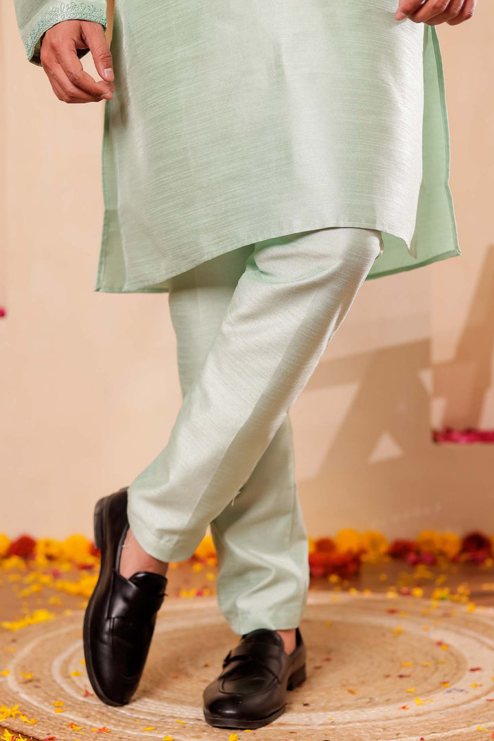 Pista green Raw Silk Kurta Suit with Intricate work on neckline.