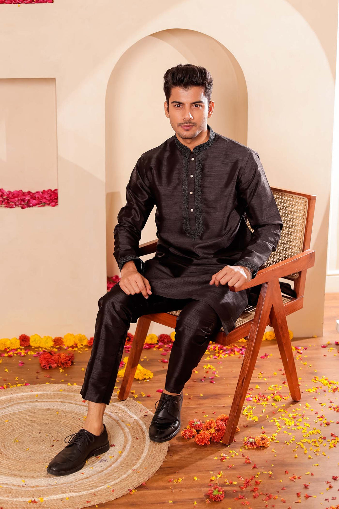 Black Raw Silk Kurta Suit with Intricate work on neckline.