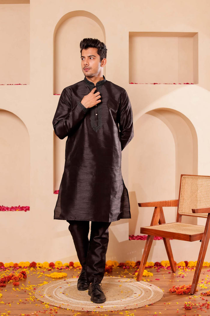 Black Raw Silk Kurta Suit with Intricate work on neckline.