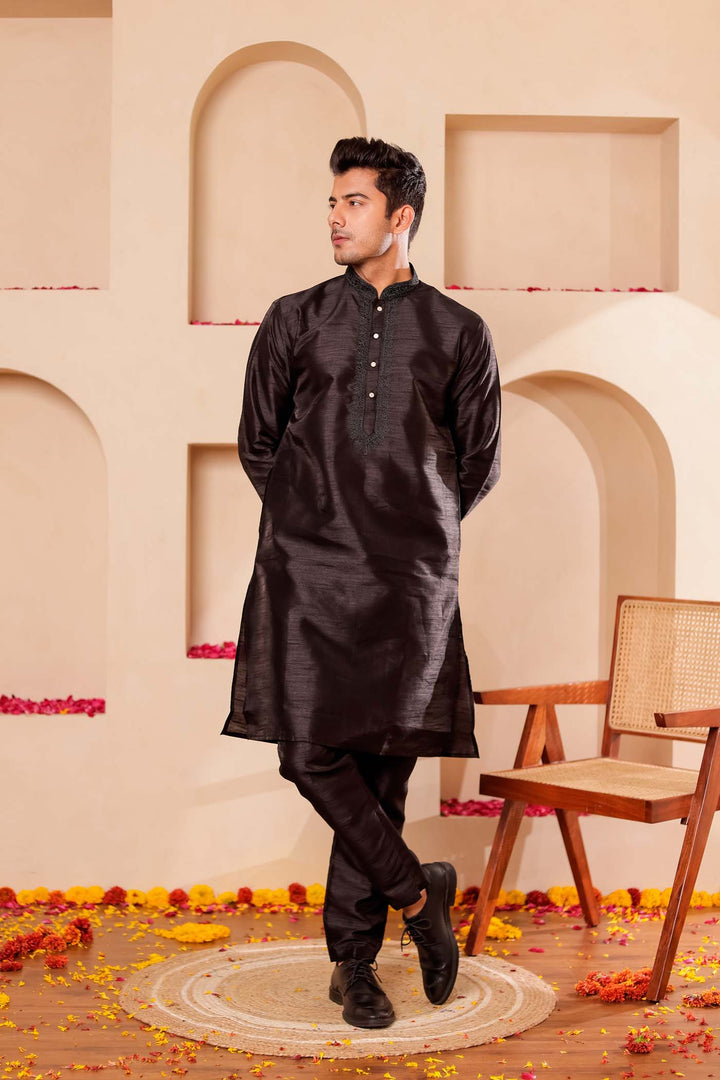 Black Raw Silk Kurta Suit with Intricate work on neckline.