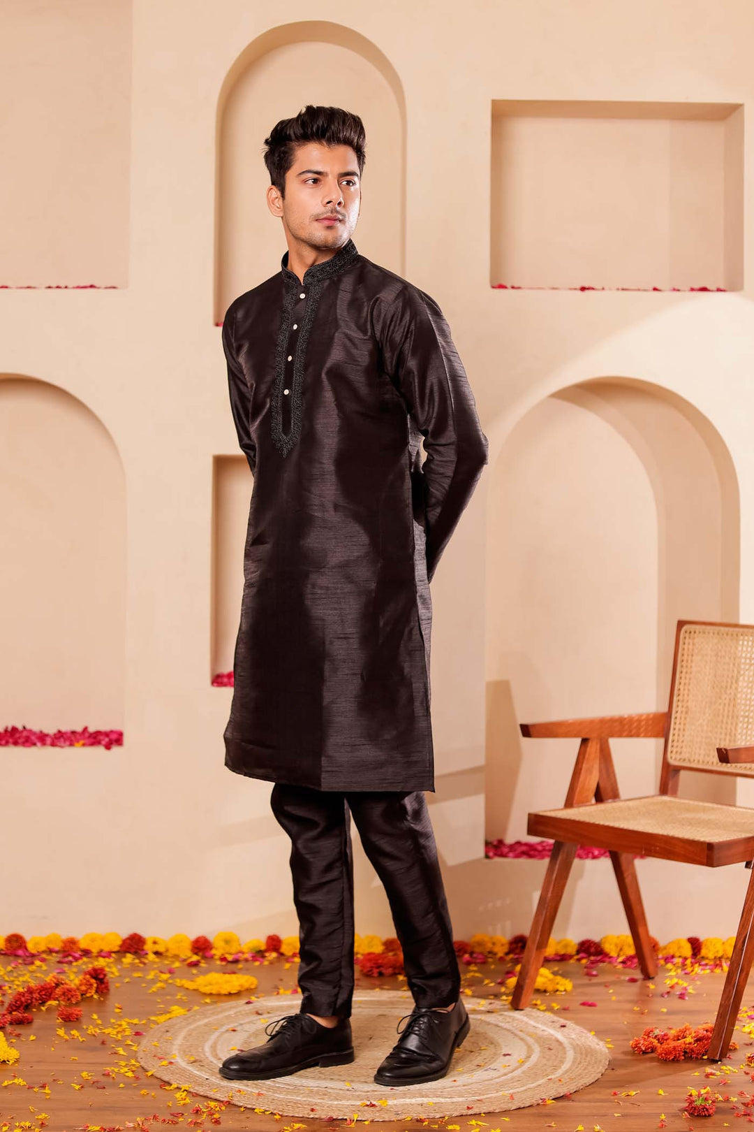 Black Raw Silk Kurta Suit with Intricate work on neckline.