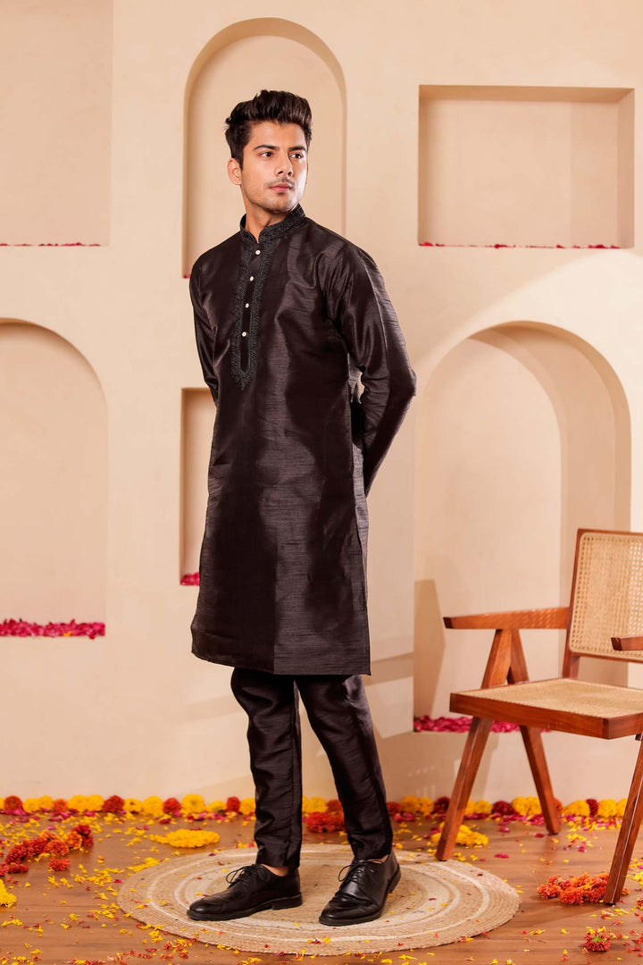 Black Raw Silk Kurta Suit with Intricate work on neckline.