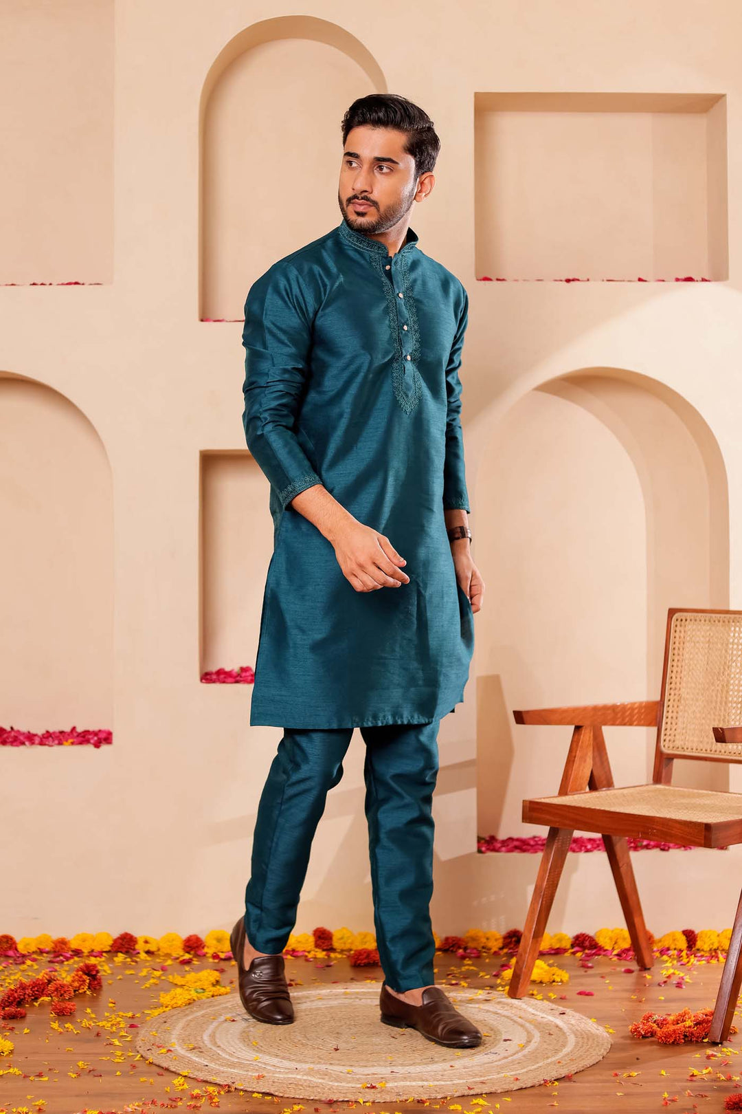 Teal Green Raw Silk Kurta Suit with Intricate work on neckline.