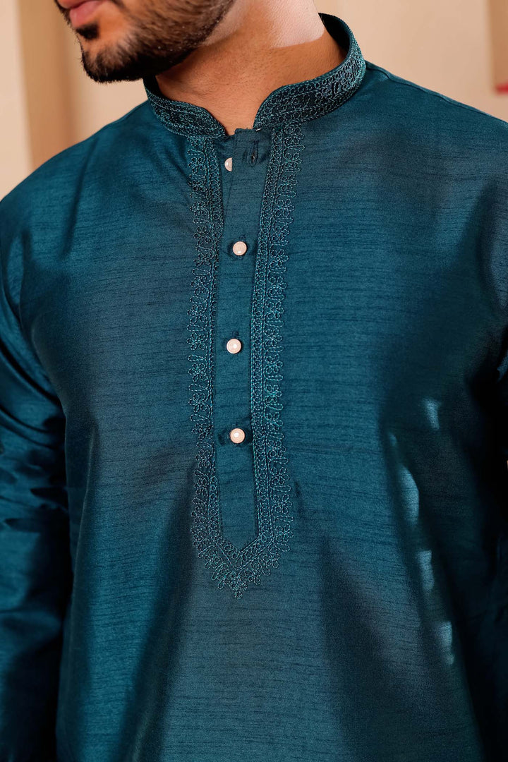 Teal Green Raw Silk Kurta Suit with Intricate work on neckline.