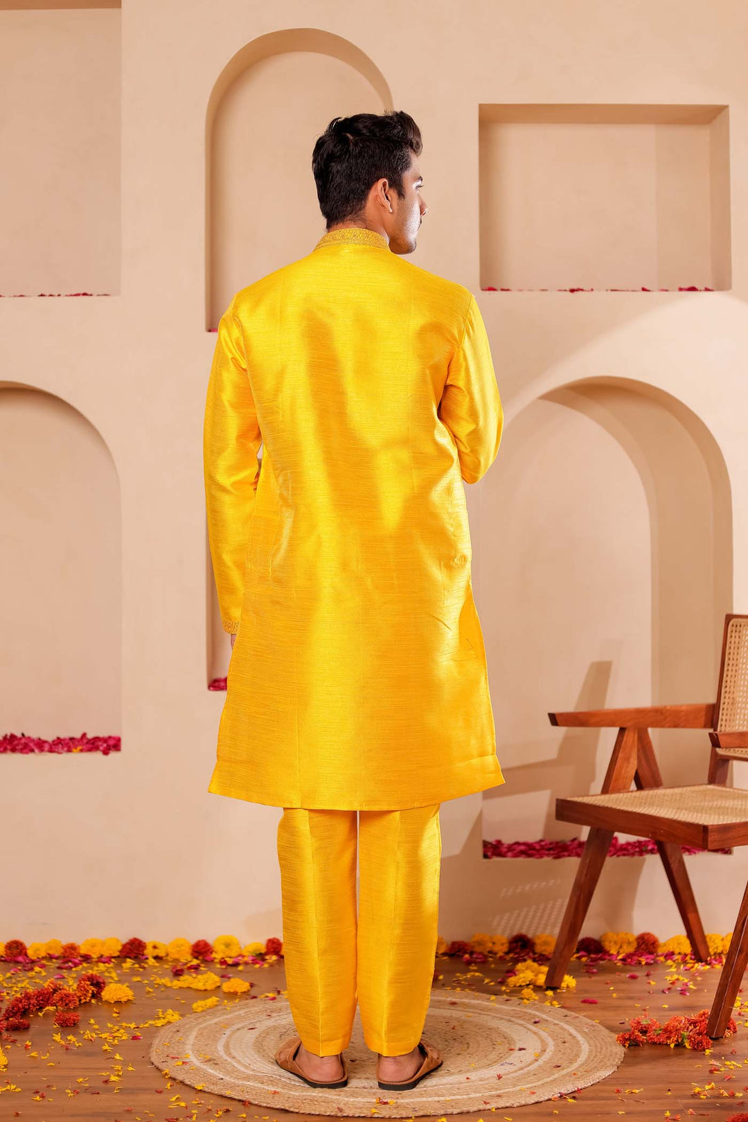 Yellow Raw Silk Kurta Suit with Intricate work on neckline.