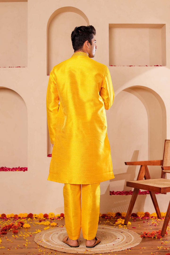 Yellow Raw Silk Kurta Suit with Intricate work on neckline.