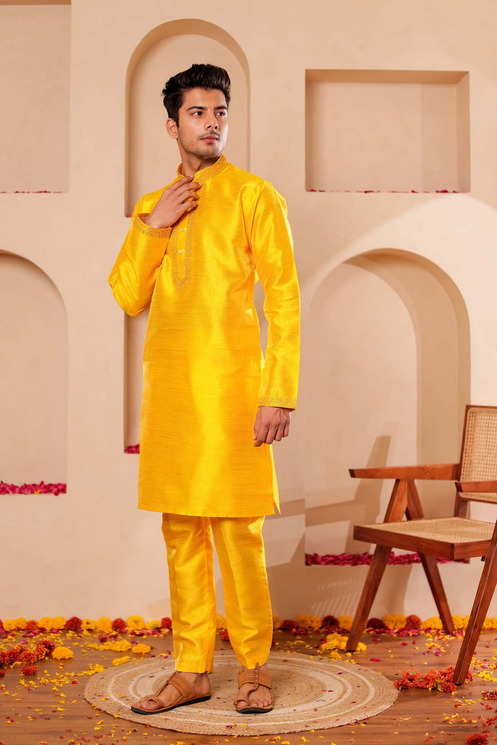 Yellow Raw Silk Kurta Suit with Intricate work on neckline.