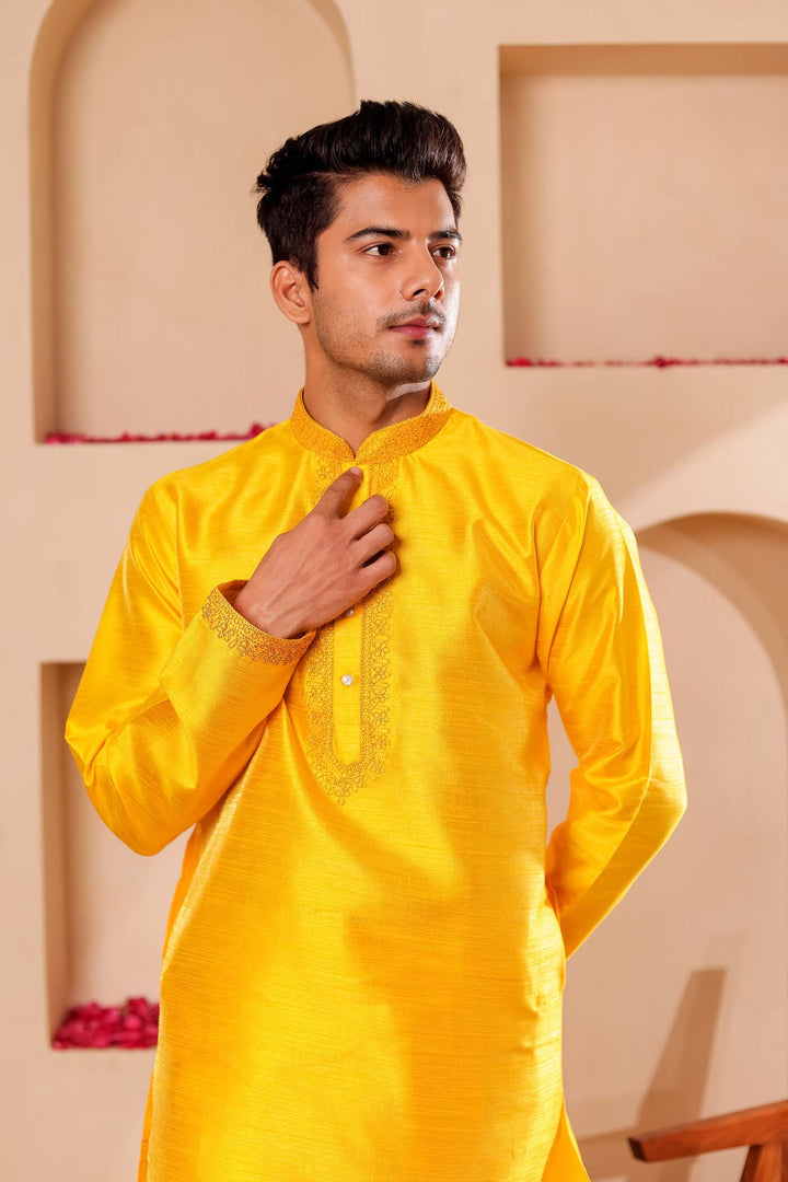 Yellow Raw Silk Kurta Suit with Intricate work on neckline.
