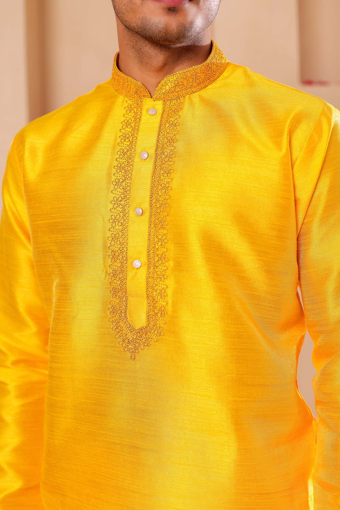 Yellow Raw Silk Kurta Suit with Intricate work on neckline.
