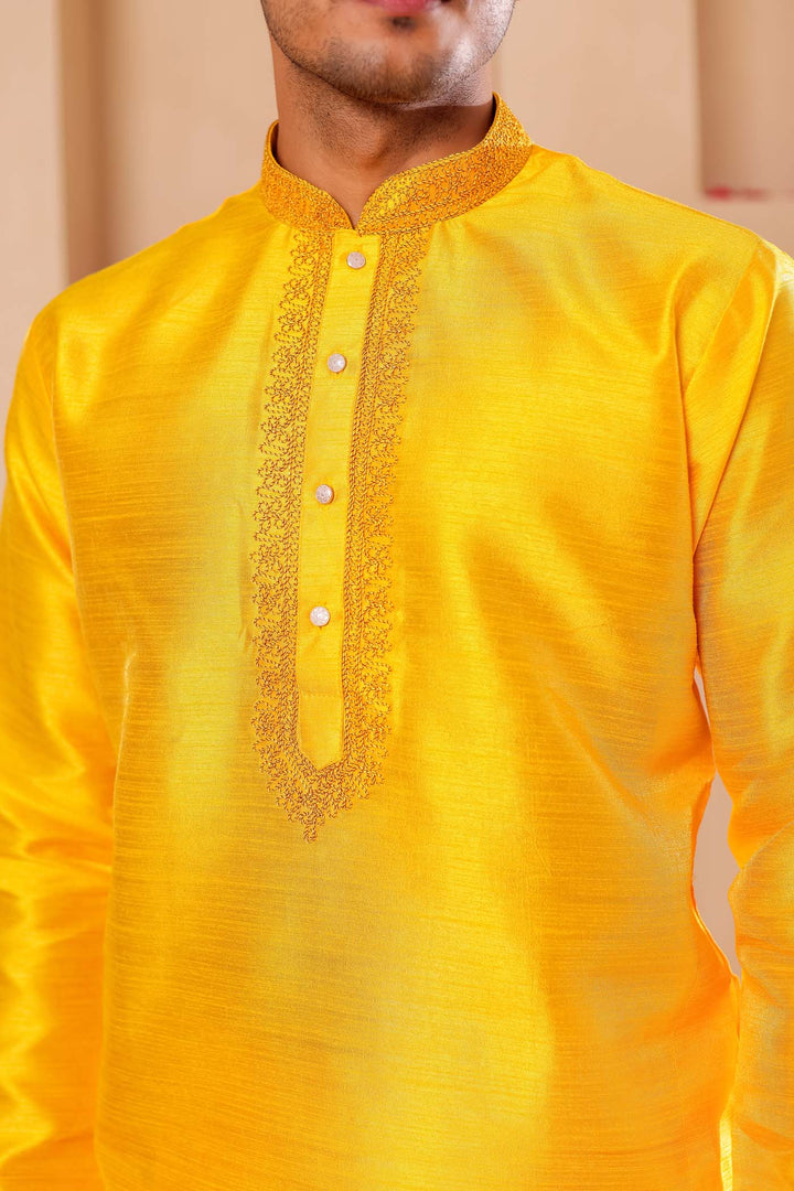 Yellow Raw Silk Kurta Suit with Intricate work on neckline.
